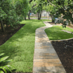 Yard with newly installed grass around pathway