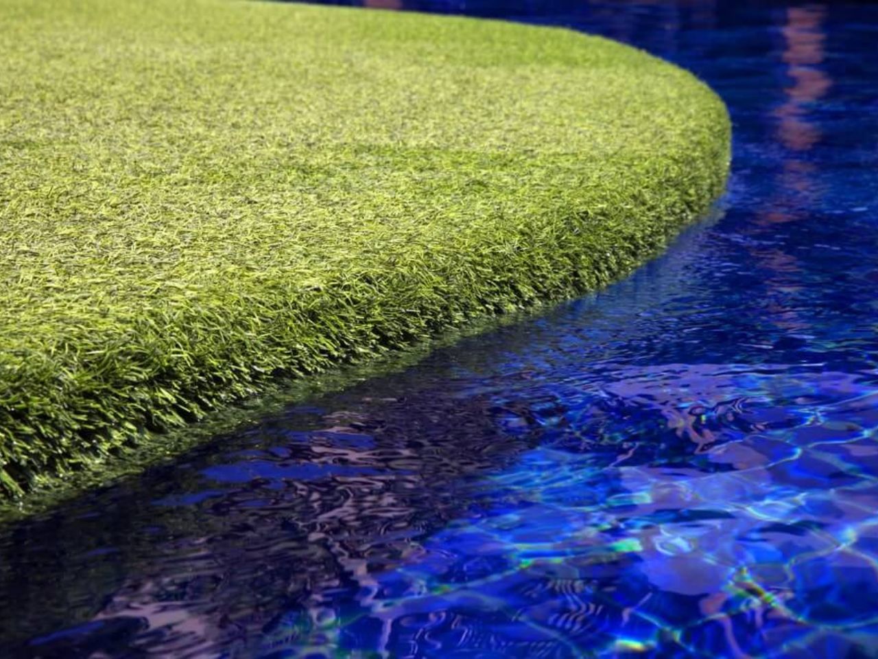 Grass next to pool