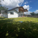 Reviewer's photo of his back yard with fresh sod grass