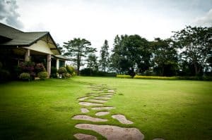 home with built in stone pathway in the lawn